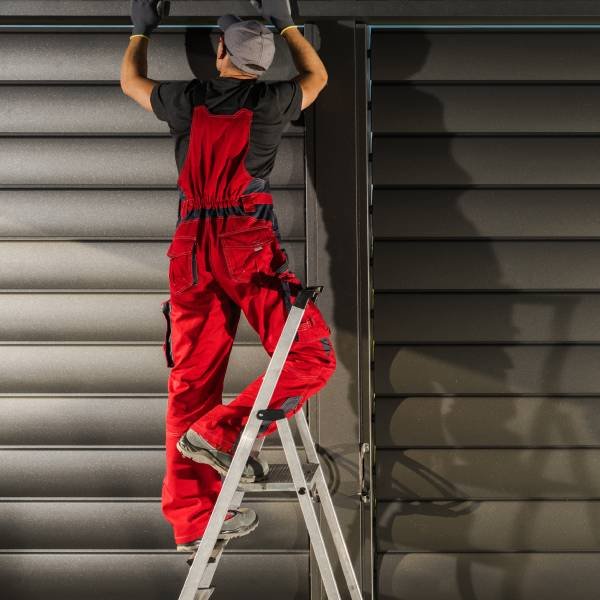 Garage door expert fixing electric motor
